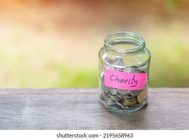 Concept Of International Day Of Charity, 5 September. Money In Jar Collector.