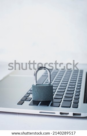 Concept of internet data protection. Security system. Using laptop safety. Development of reliable online protection system. Laptop and padlock with keys on the table. Network hacking protection.