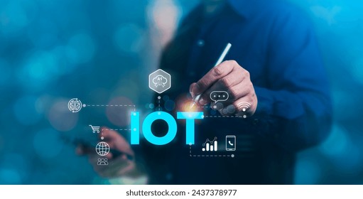 Concept of Internet of Things (IoT), technology, innovation, business and development, A man touching a virtual screen displaying "IOT"