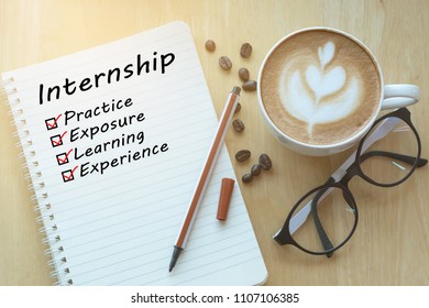 Concept Internship benefits message on notebook with glasses, pencil and coffee cup on wooden table. - Powered by Shutterstock