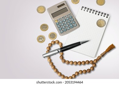 Concept Of Islamic Finance. Coins And Praying Beads. Zakat, Islamic Banking