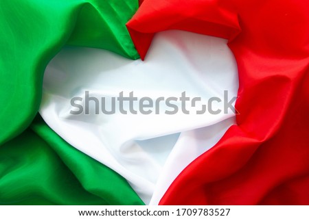 The concept of Italy patriotism - April 25 Liberation Day Text in italian card, italy flag and poppy flowers national public holiday