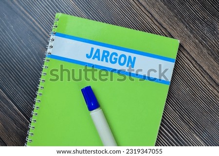 Concept of Jargon write on book isolated on Wooden Table.