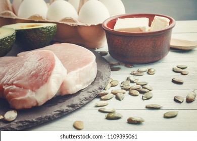 Concept of ketogenic diet. Dietary food on light table