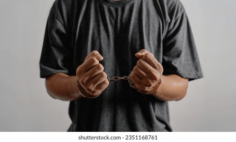 concept of kidnap victim imprison arrest crime alleged offender man with hand shackle background. victim kidnap imprison arrest crime alleged offender man with hand shackle. kidnap imprison victim 