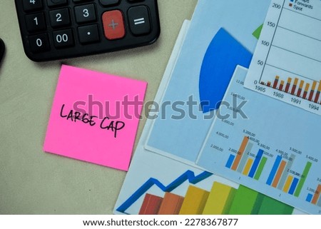 Concept of Large Cap write on sticky notes with stock market isolated on Wooden Table.