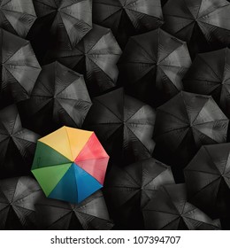 Concept of leader with with many blacks and a colorful umbrella