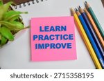 Concept of learn practice improve write on sticky notes isolated on Wooden Table.