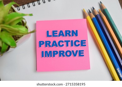 Concept of learn practice improve write on sticky notes isolated on Wooden Table.