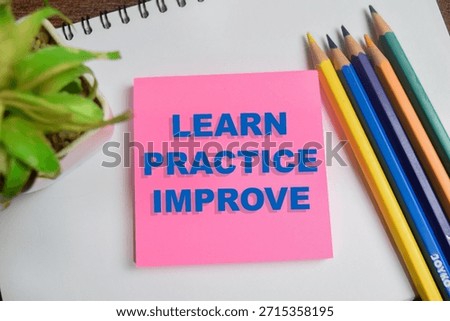 Concept of learn practice improve write on sticky notes isolated on Wooden Table.