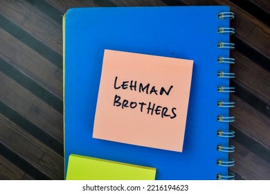 Concept Of Lehman Brothers Write On Sticky Notes Isolated On Wooden Table. Selective Focus On Lehman Brothers Text