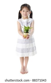 Concept Of Little Girl Holding A Plant On White Background