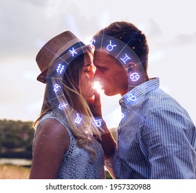 Concept of love compatibility between zodiac signs. Horoscope astrology zodiac. Couple kissing at sunset.