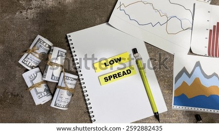 Concept of Low Spread write on sticky notes isolated on Wooden Table.