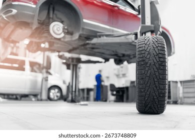 Concept maintenance of auto, background with sunlight. Car tires pile in garage service center or shop.