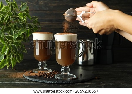 Concept of making Irish coffee on wooden table