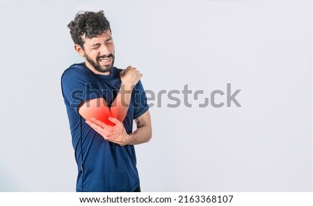 Concept of a man with rheumatism elbow pain, man massaging sore elbow, man with elbow cramp, Person with elbow pain