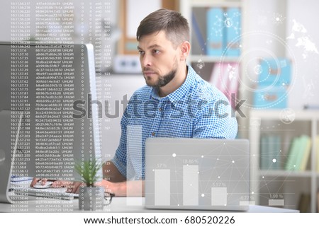 Concept of management information systems. Man working with computer at table in office