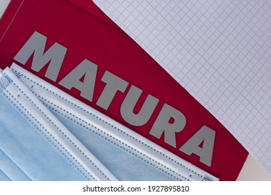 Concept Of Matura Exam During The Pandemic. Closeup Of The Word “matura” And Protective Face Masks.