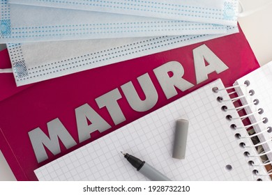 Concept Of Matura Exam During The Pandemic. Closeup Of The Word “matura” And Protective Face Masks.