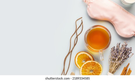 Concept of Me time and no depression. Self-care flat lay with sleep mask, lavender flower, herbal tea, dry fruits and aroma sticks on a blue background with copy space. Healthy sleep is healthy life - Shutterstock ID 2189334585