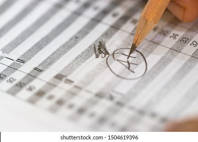 Concept Of Measurement And Evaluation. Hand Of Teacher Using Pencil Written Text On Paper Of Final Grades For Each Course. The Number Of Grade Points Student Earned In Given Period Of Time Of School.