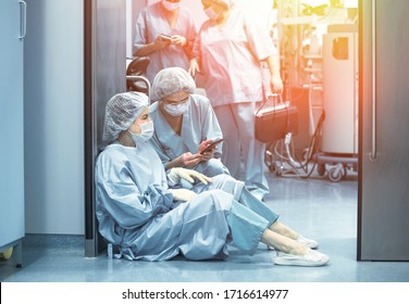 Concept of medecine surgery, Kovid 19. Tired, exhausted doctor after an exhausting shift in the intensive care unit. Pandemic, isolation, epidemic hard work of doctors, stay home. - Powered by Shutterstock