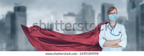 Concept\
of medical doctors fighting against global pandemic virus. Portrait\
of young hero woman with super person red cape and medical uniform\
and mask protect city from corona virus\
outbreak.