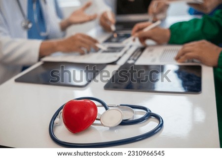 concept of medical team meeting to discuss about treating heart disease with surgery and preventing recurrence of heart disease later. medical team meeting about cardiology to treat patients.