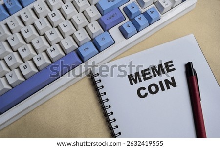 Concept of Meme coin write on book isolated on Wooden Table.