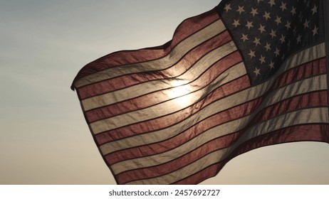 Concept of Memorial Day, Remember and Honor, 4th of July, Independence Day, Veteran Day, Holiday, Celebration. American USA flag waving in sunset outdoor background for honoring, mourning USA military - Powered by Shutterstock