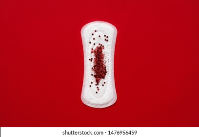 The Concept Of Menstruation And Hygiene Products For Women. Spacer And Blood From Sparkles And Glitter. Transitional Age