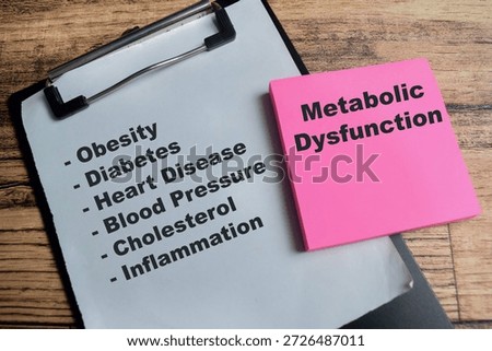 Concept of metabolic dysfunction write on sticky notes with keywords isolated on Wooden Table.