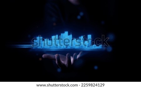 concept of metaverse technology man hand holding hologram cyber digital data city landscape real estate building background. meta city landscape cyberspace. metaverse concept                         