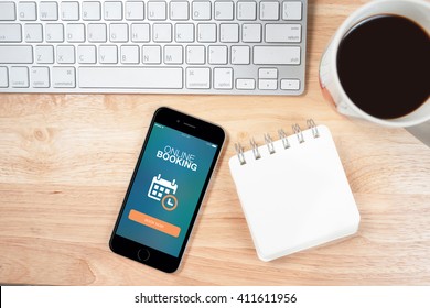 Concept Mobile Online Booking On The Table