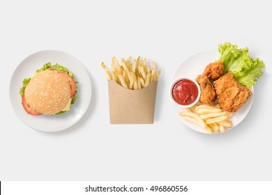 Concept of mock up burger, french fries and fried chicken set isolated on white background. Copy space for text and logo. Clipping Path included on white background.