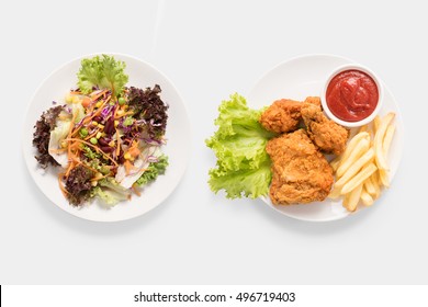 Concept of mock up fresh salad and Fried chicken and french fries set isolated on white background. Clipping Path included on white background. Contrasting food. - Powered by Shutterstock