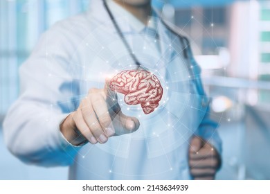 Concept of modern brain treatment technology. Doctor clicks on interface screen with patient brain. - Shutterstock ID 2143634939