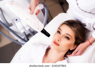 The Concept Of Modern Cosmetic Procedures. Facial Cleansing. The Procedure Of Laser Carbon Peeling In The Clinic Of Aesthetic Medicine. Photo Carbon Cleaning.