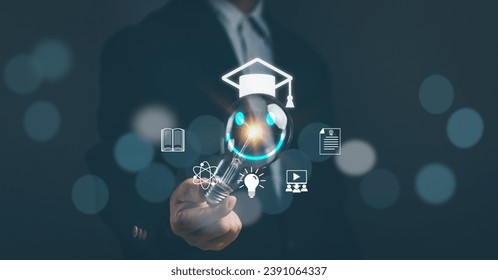 Concept of modern educational technology learning curriculum or online classroom learning.Man hand holds light bulb to learn an educational curriculum to develop skills with virtual reality screen.