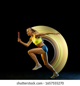 Concept of motion and action in sport. Young caucasian woman, professional runner on black background, leader. Relay race. Sport, healthy lifestyle, movement, wellness. Abstract design.