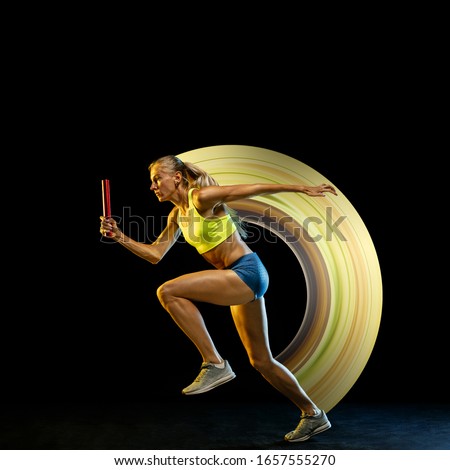 Similar – Rear view portrait of one young middle age athletic woman at crossfit training, exercising with trx suspension fitness straps over dark background