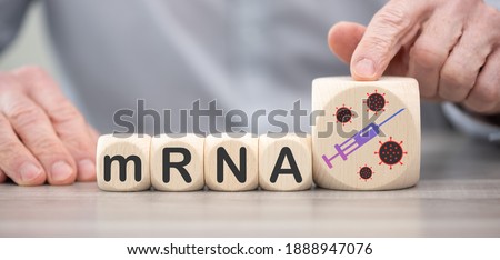 Concept of mRNA vaccines on wooden cubes