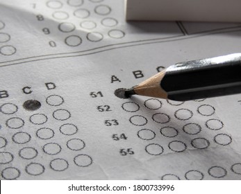 Concept Of Multiple Choice Question With Pencil Eraser And Paper.