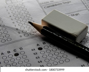 Concept Of Multiple Choice Question With Pencil Eraser And Paper.