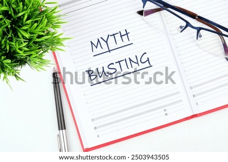 Concept MYTH BUSTING word, text in a business notebook, a note on a white background