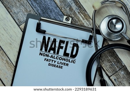 Concept of NAFLD - Non-Alcoholic Fatty Liver Disease write on paperwork with stethoscope isolated on Wooden Table.