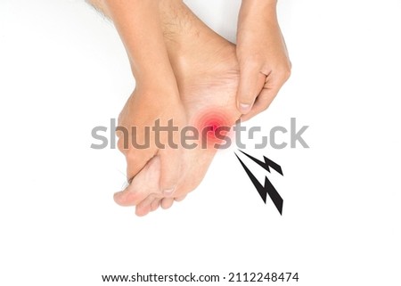 Concept of nail prick and cellulitis in foot of Asian young man. Sensory neuropathy problems. Foot nerves problems. Plantar fasciitis. Stock photo © 