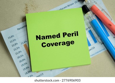 Concept of named peril coverage write on sticky notes isolated on Wooden Table.