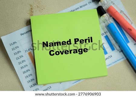 Concept of named peril coverage write on sticky notes isolated on Wooden Table.